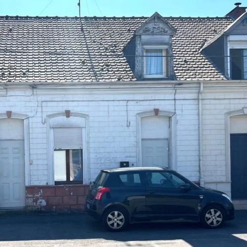 Maison mitoyenne de 69m2 utiles actuellement louée bâtie sur