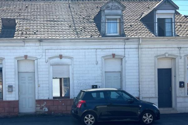 Maison mitoyenne de 69m2 utiles actuellement louée bâtie sur
