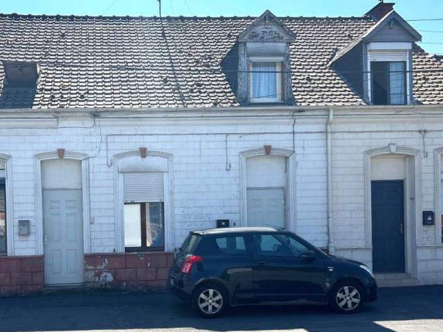 Maison mitoyenne de 69m2 utiles actuellement louée bâtie sur